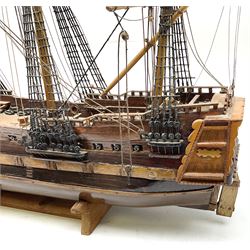 Kit built model of a three masted sailing ship, with rigging, upon a wooden stand, L69cm, H63cm