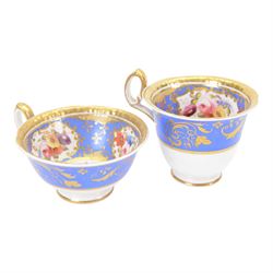 H&R Daniel trio, coffee cup, teacup and a saucer, circa 1825, Gadroon shape with D handle, painted with reserves of fine foliate sprays against a blue ground with gilt trellis detail, coffee cup including handle H8.5cm, saucer D14cm