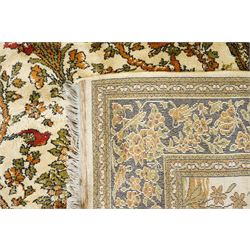 Kashan style rug, twin peacocks flanking a large decorative urn, motifs tree of life style, multiple borders with fine floral patterns 