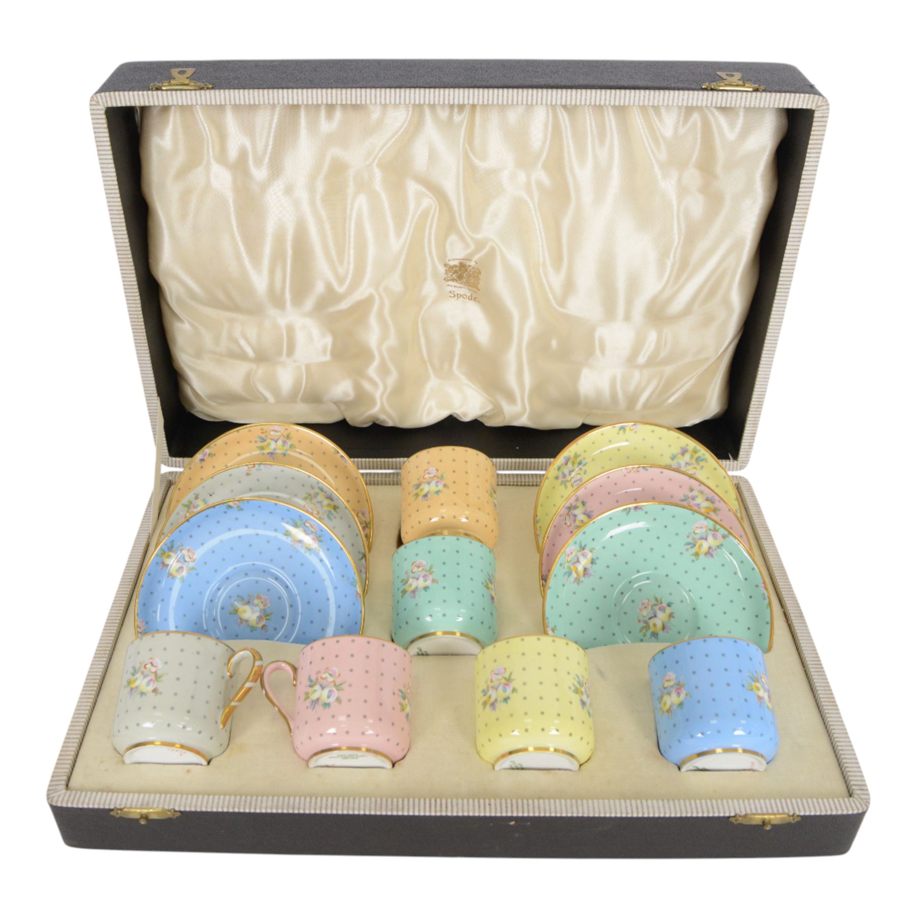 Spode six coffee cups and saucers cased set, decorated with floral sprigs on a polka dot ground with gilt detail