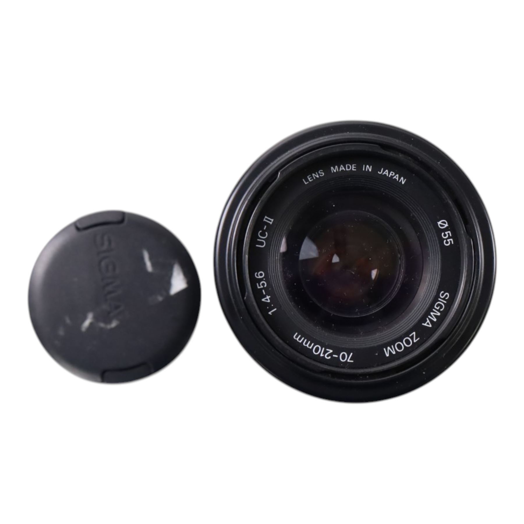 Eight camera lenses, comprising Canon Ultrasonic Zoom EF 75-300mm 1:4-5.6 lens, AF Nikkor 35-70mm 1:3.3-4.5 lens, Nikkor 60-180mm 1:4.5-5.6 lens, Canon Zoom EF 28-80mm 1:3.5-5.6 lens, Canon Zoom EF 80-200mm 1:4.5-5.6 lens, Sigma 70-300mm 1:4.6-5.6 DL Macro, Sigma Zoom 70-210mm 1:4-5.6 UCII lens and a Sigma AF 70-300mm 1:4-5.6 APO Macro lens, all with lens caps