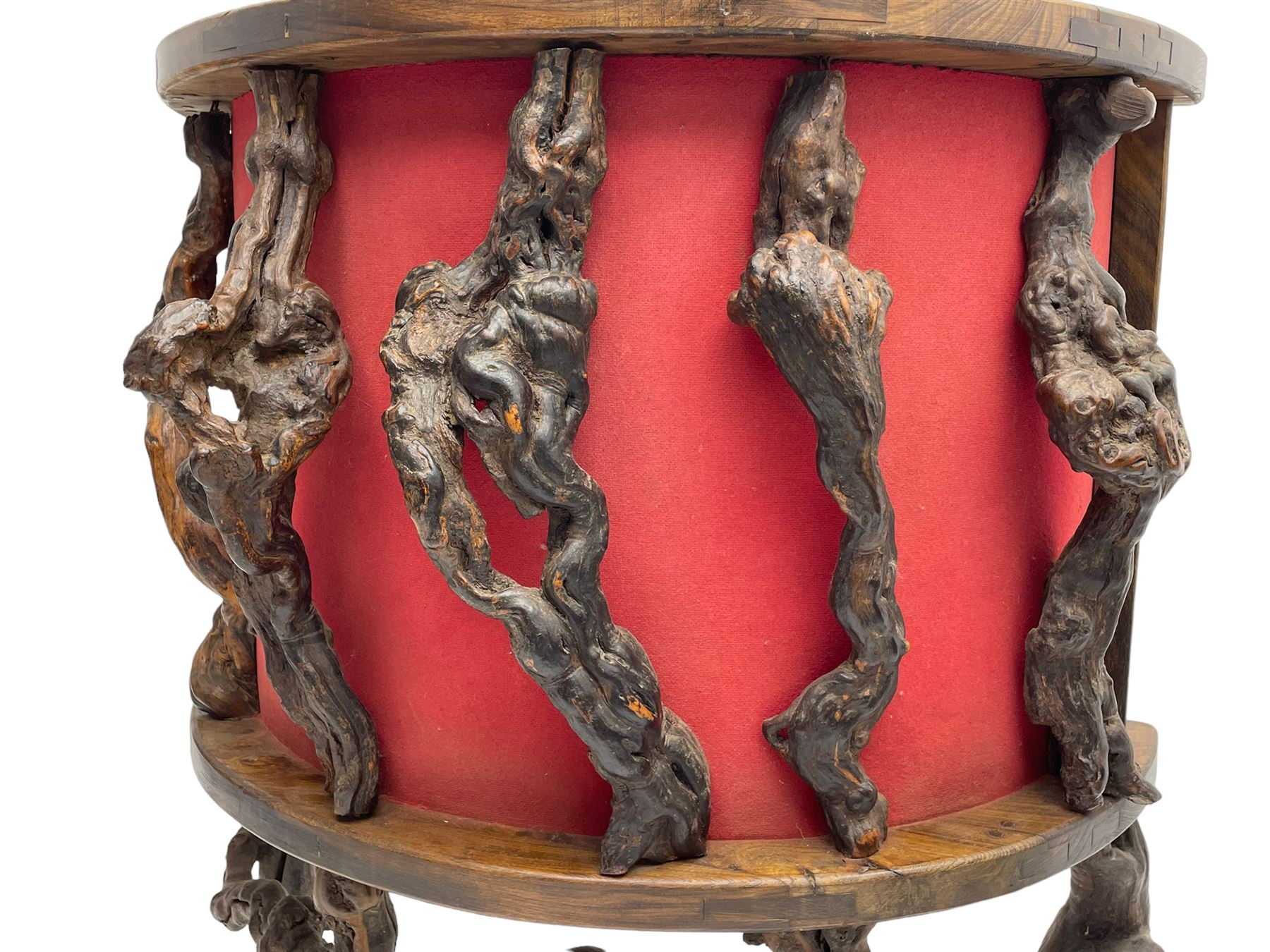 Mid-20th century French grapevine and walnut bow-front wine tasting bar, the curved counter top supported by sculptural grapevine roots, fitted with single shelf and raised on rustic vine feet (W100cm H101cm); with a pair of matching bar stools, the circular top raised on three gnarled root supports united by stretchers (W50cm H70cm)