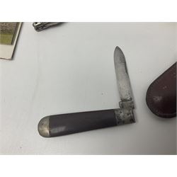 Seven pen knives, two lighters, including one Ronson example and a collection of postcards