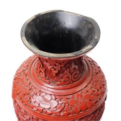 Pair of Chinese late Qing dynasty cinnabar lacquer vases, carved with scenes of figures in a landscape, H25cm (2)