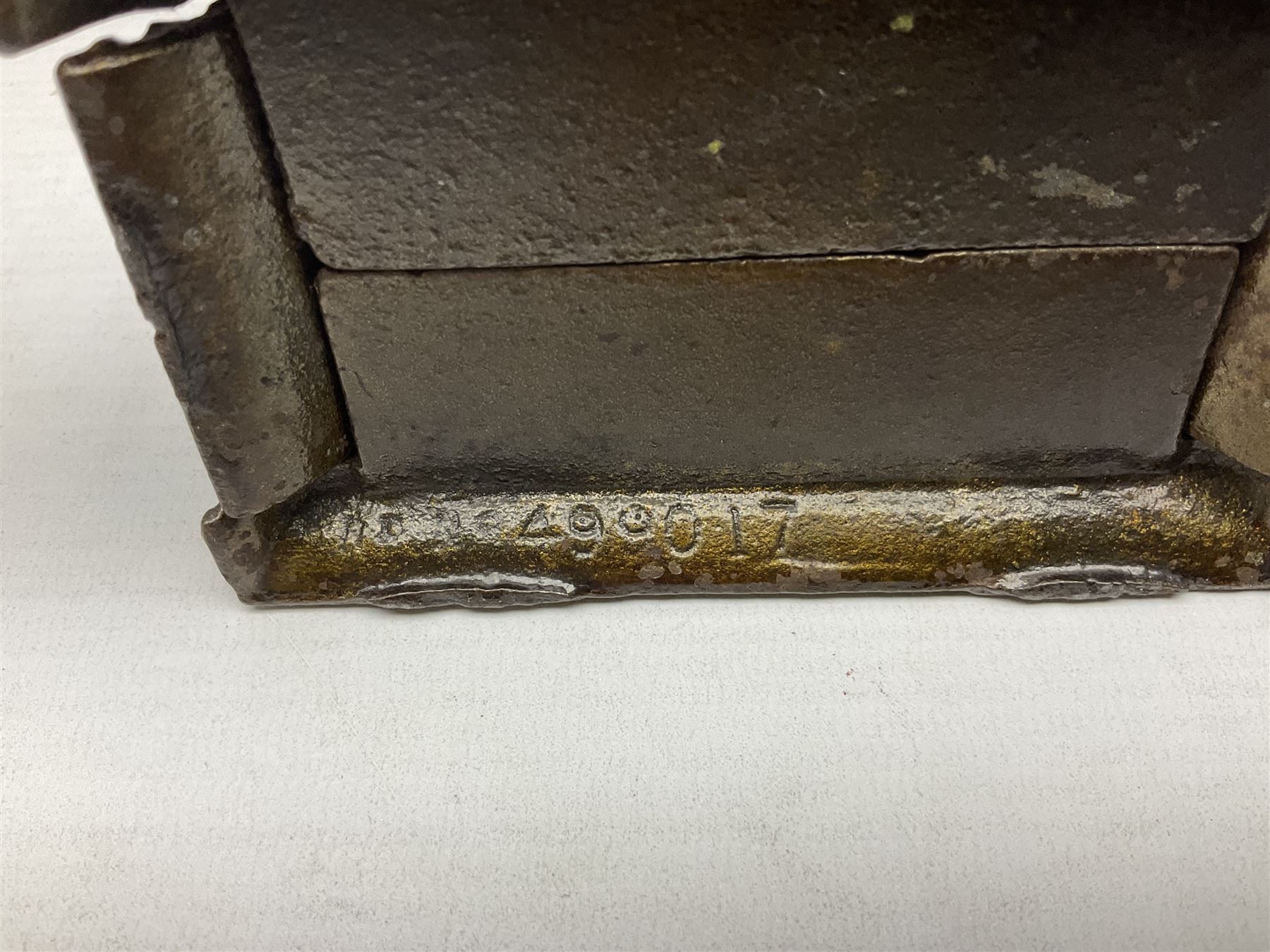 Five early 20th century cast-iron money banks as buildings - 'City Bank' c1904 H10cm; 'County Bank' c1905 H11cm; 'Town Hall Bank' c1900 H8.5cm; 'Tower Bank' c1902 H23.5cm; all made by John Harper; and 'Blackpool Tower Bank' c1907 by Chamberlain & Hill H18.5cm (5)