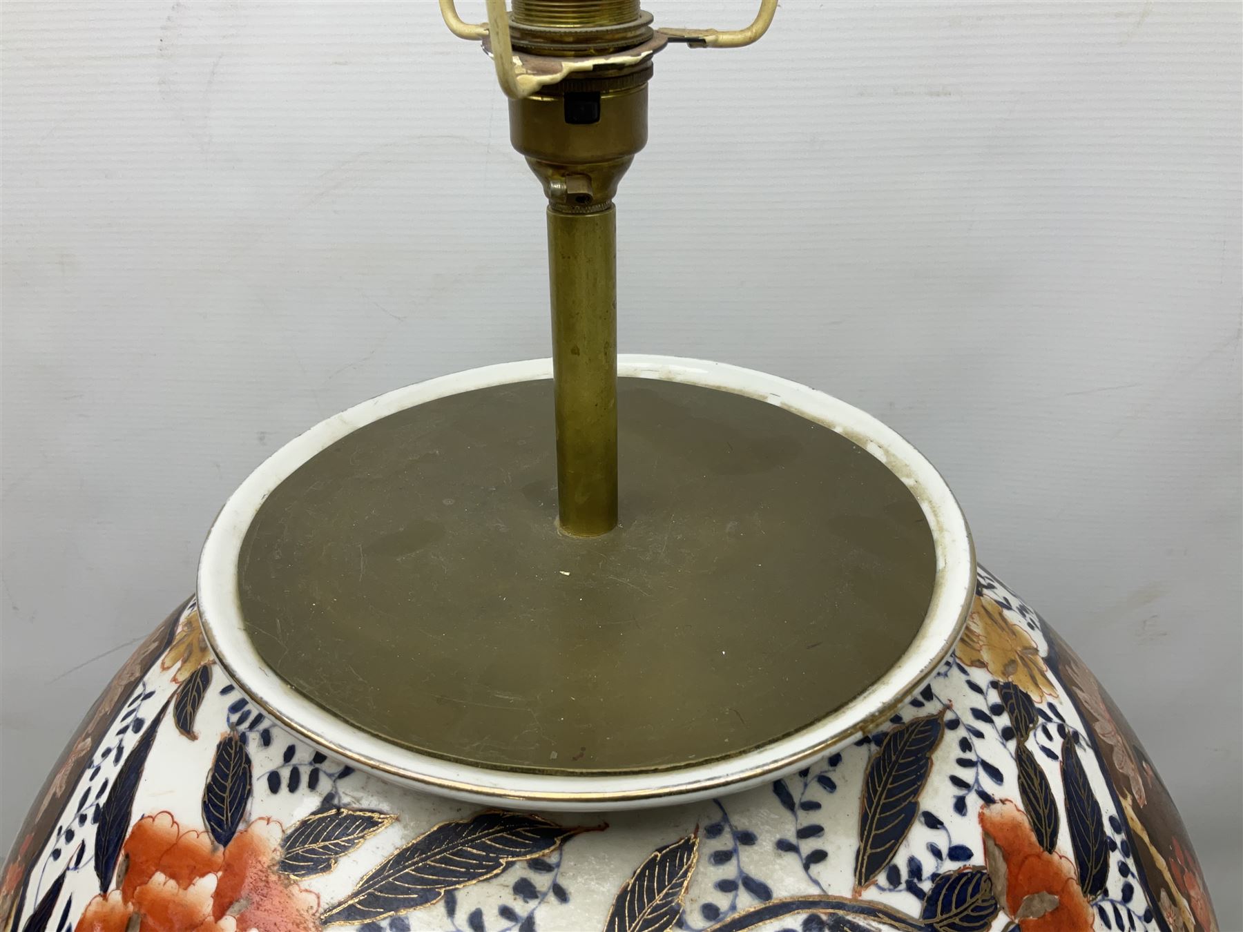 Pair of large and impressive 20th century Japanese Imari table lamps, each of ovoid form, decorated in the Imari palette with roundels containing flowering urns, and shaped panels of birds, set against a white ground decorated with blossoming peonies, lamp base (not including fixtures) H56.5cm overall including shade H89cm