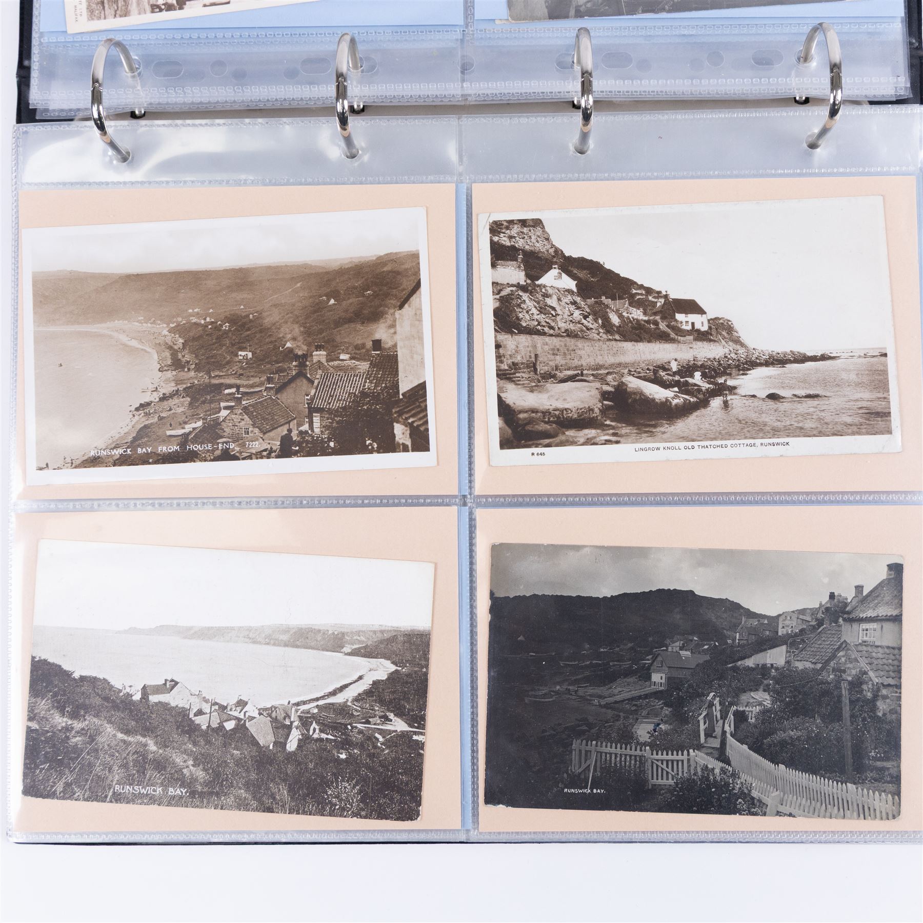 Four-hundred and twelve early 20th century Whitby District view real photographic postcards, including a selection from the Whitby Coast (176), starting at Staithes and Runswick Bay down to Robin Hoods Bay and a selection from the Valley of the River Esk (236), including Ruswarp, Rig Mill, Sneaton, Sleights, Grosmont, Egton, Glaisdale, Danby, Castleton and Goathland, all housed within two postcard albums