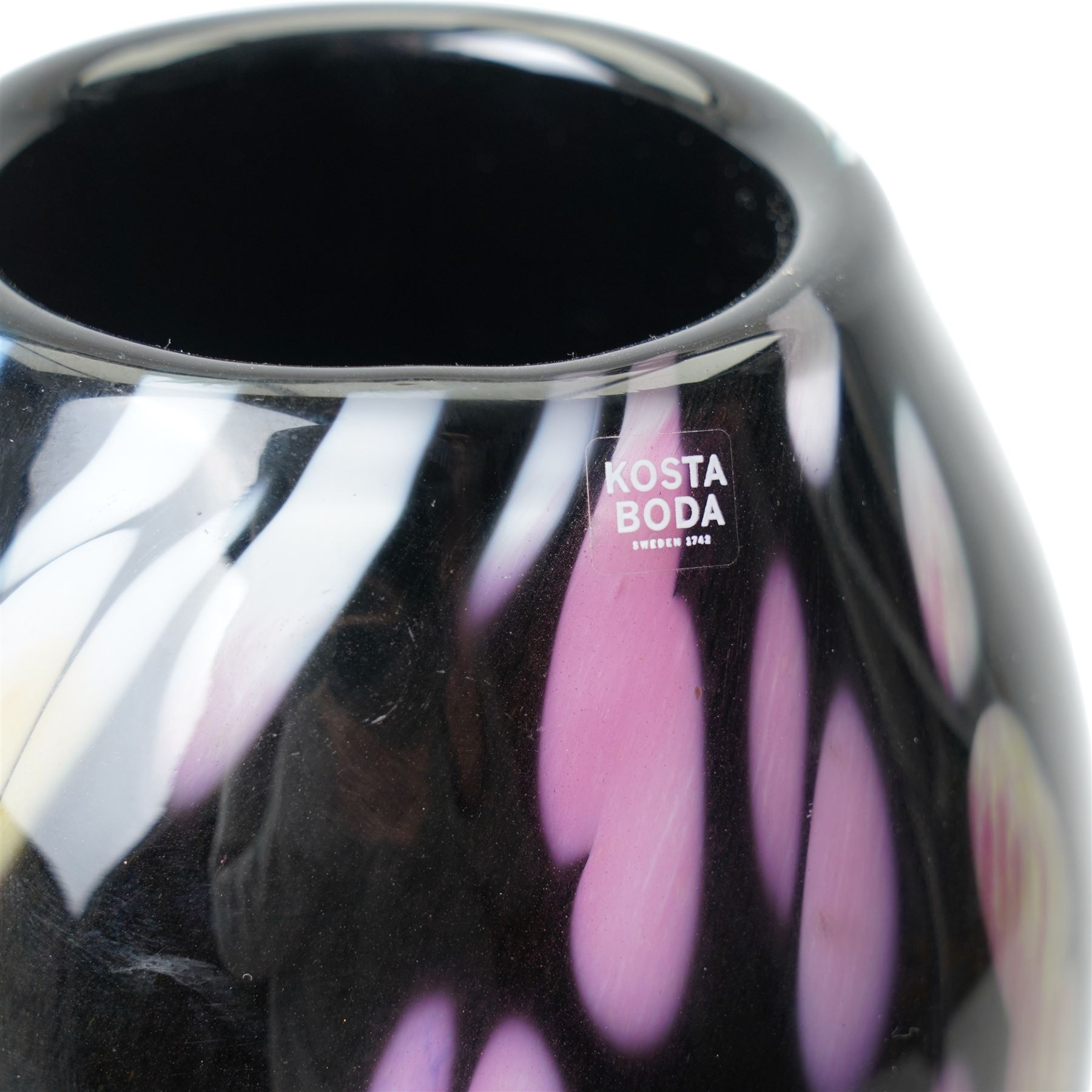 Ludvig Lofgren for Kosta Boda vase, decorated with mottled detail in purples and greens, upon a black ground, signed beneath, H46cm