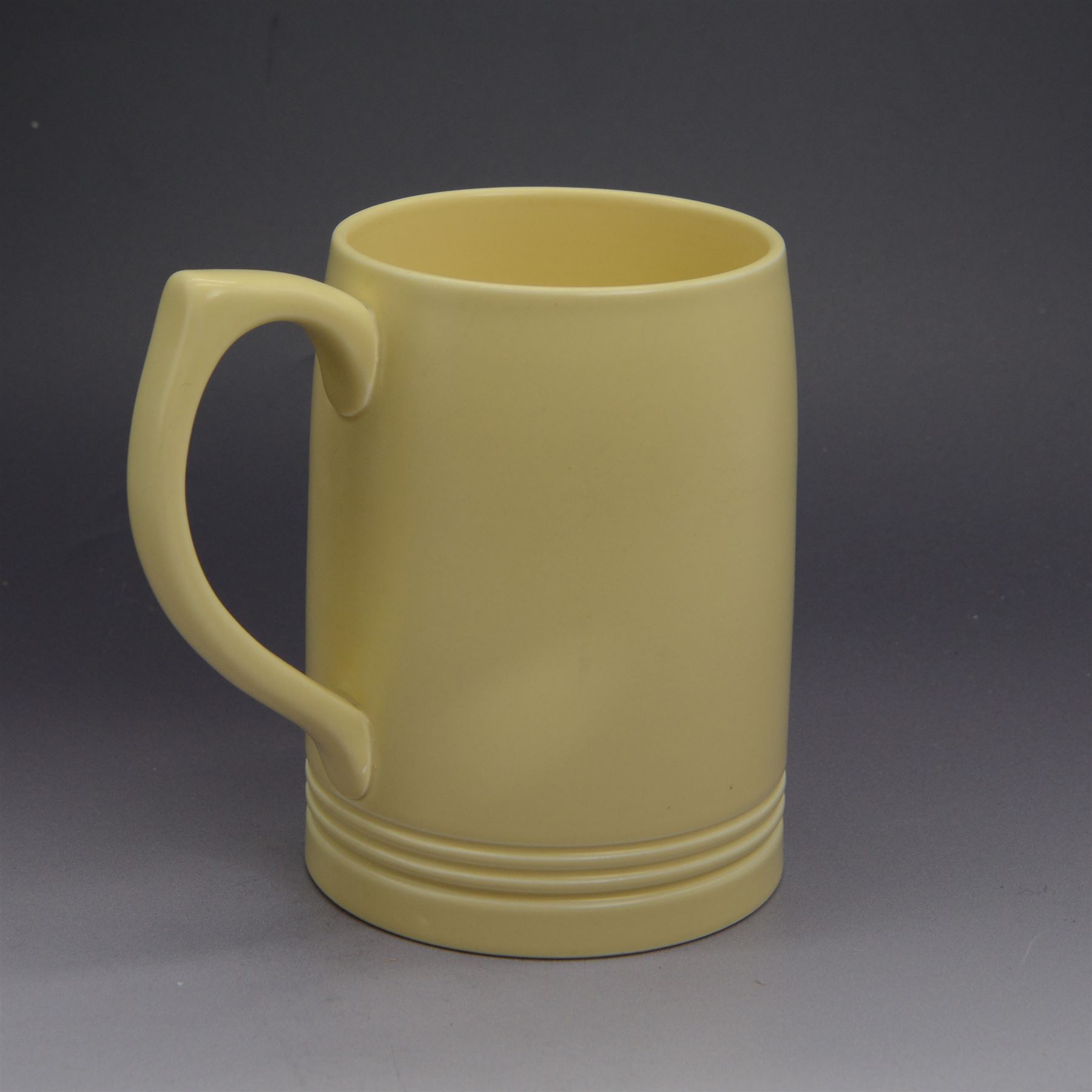 Keith Murray for Wedgwood, ribbed globe vase, together with a plate and tankard, all with printed marks beneath, vase H17cm 