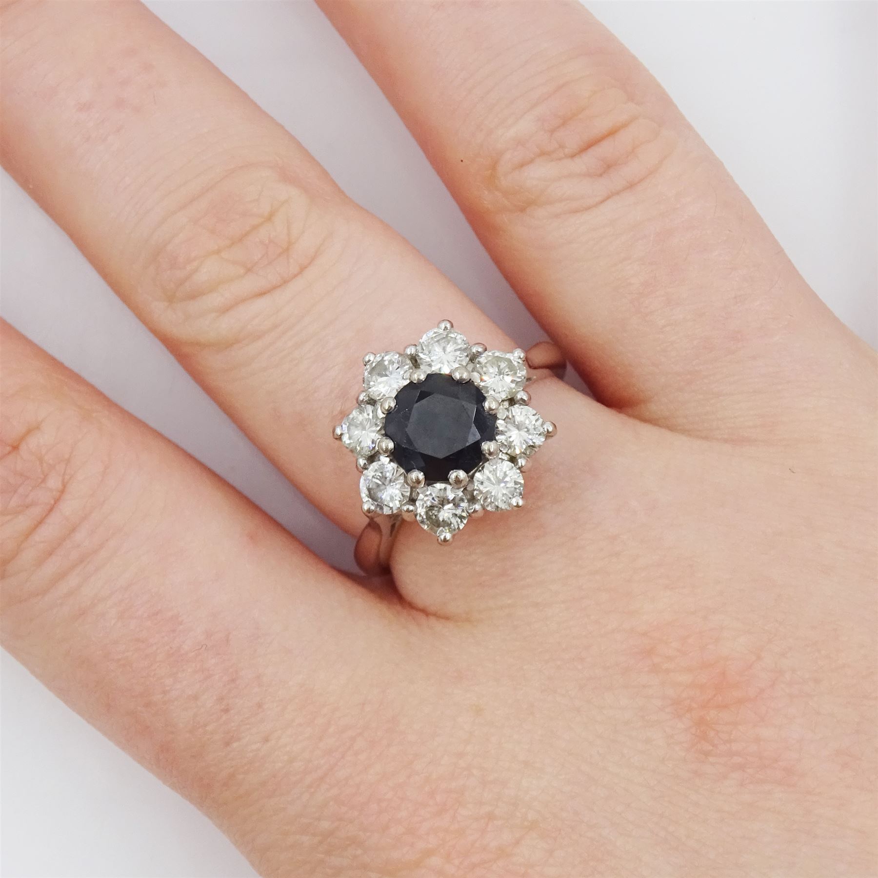 White gold round cut sapphire and round brilliant cut diamond cluster ring, stamped 18ct, sapphire approx 1.35 carat, total diamond weight approx 1.20 carat