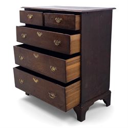 18th century oak chest, the rectangular top above an arrangement of two short over three long drawers fitted with brass batwing handles and escutcheons, raised upon shaped bracket feet