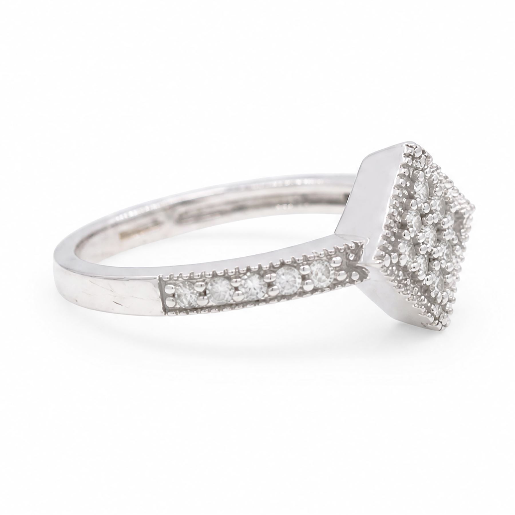 9ct white gold diamond shaped diamond ring, pave set with nine round cut diamonds, with diamond set shoulders, Birmingham 2006