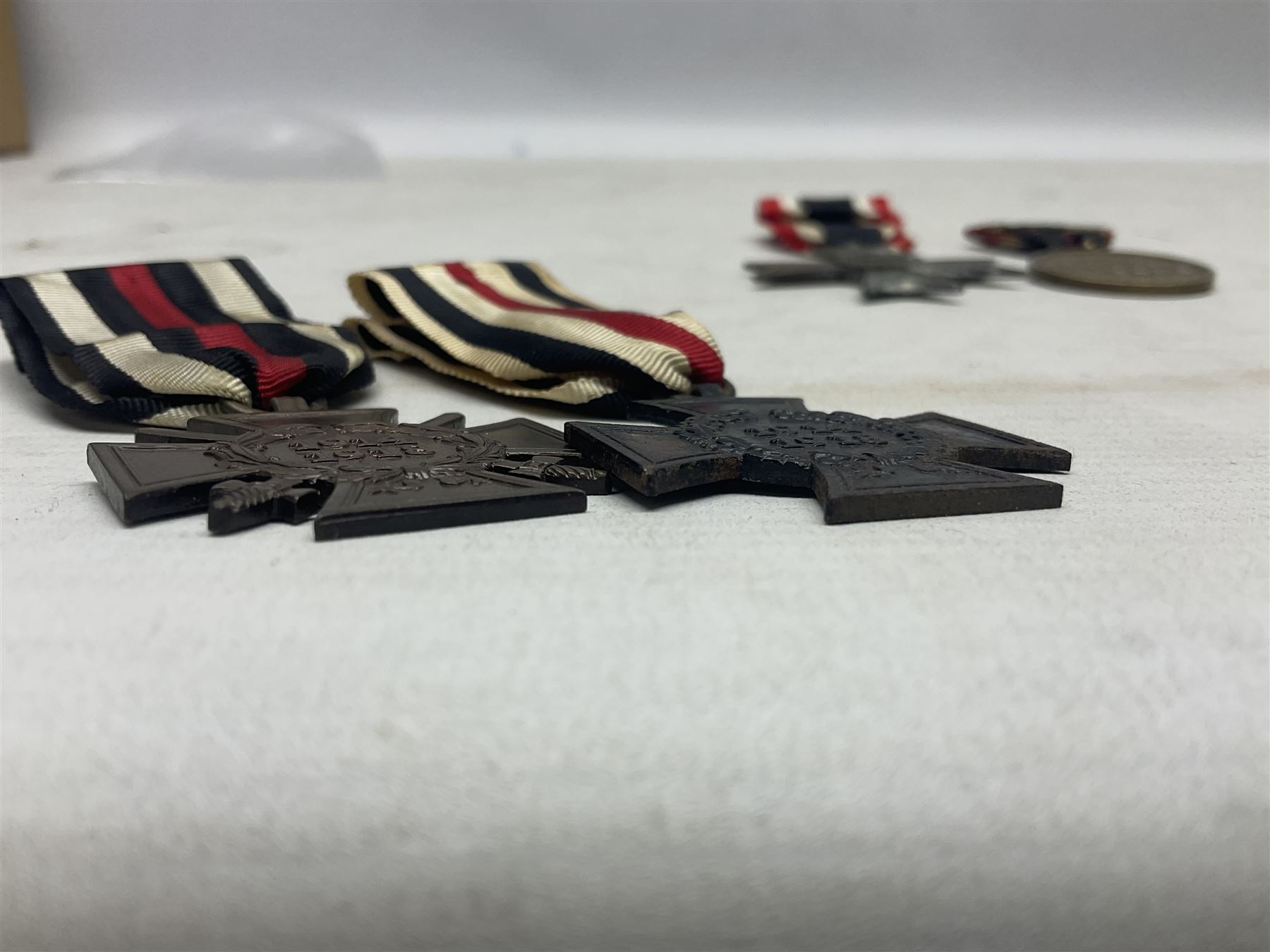 Two WW1 German medals - copy Cross of Honour with swords (combatants); Cross of Honour without swords (non-combatants); and two WW2 German medals - War Merit Medal; and War Merit Cross; all with ribbons (4)