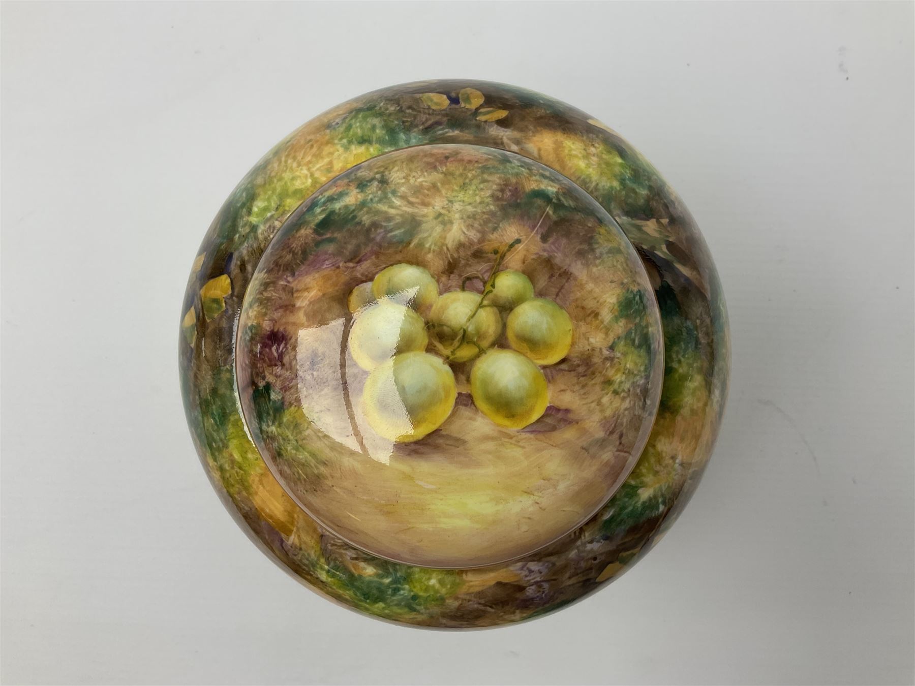 Mid/late 20th century Royal Worcester ginger jar and cover decorated by R Lewis, hand painted with a still life of fruit upon a mossy ground, signed R Lewis, with black printed mark beneath and painted shape number 2826, H17.5cm