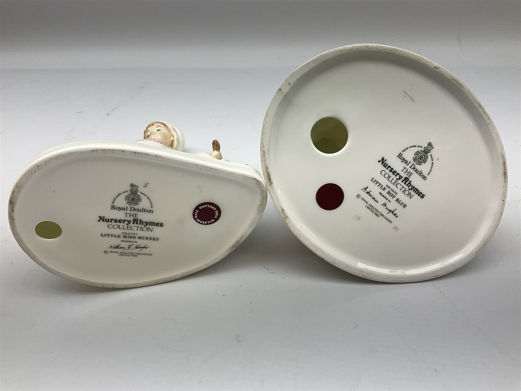 Seven Royal Doulton figures from the Nursery Rhymes Collection comprising, Tom Tom, the piper's son HN3032, Little Jack Horner HN3034, Wee Willie Winkie HN3031, Polly, put the kettle on HN3021, Little Bo-peep HN3030, Little Boy Blue HN3035, Little Miss Muffet HN2727, together with two Royal Doulton Mary had a little lamb figures HN2048 and COPR1948, all with printed marks beneath  