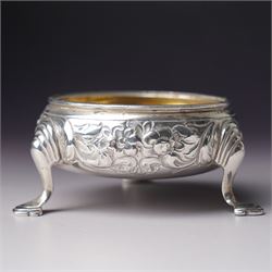 Pair of George III silver circular salts with gilded interiors and embossed decoration and two 19th century condiment spoons, one by Peter and Ann Bateman 