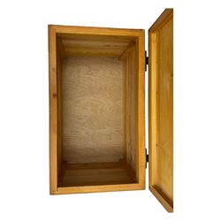 Contemporary polished pine blanket chest, the hinged planked lid with iron strap hinges and clasp fitting, plain boarded sides, fitted with blackened metal drop handles, on a moulded plinth base