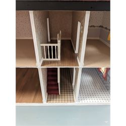 Double fronted two storey dolls house, together with a collection of mid 20th century and later dolls house furniture, H61cm