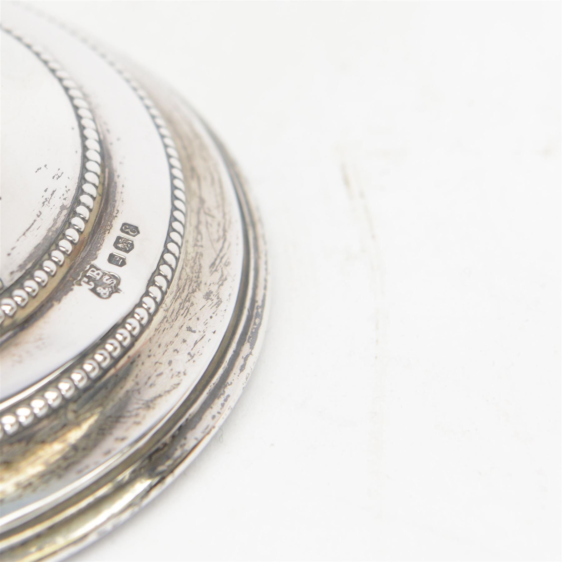 Pair of late 20th century silver mounted candlesticks, of tapering form with beaded rims, hallmarked Cooper Brothers & Sons Ltd, Sheffield 1972, H20cm