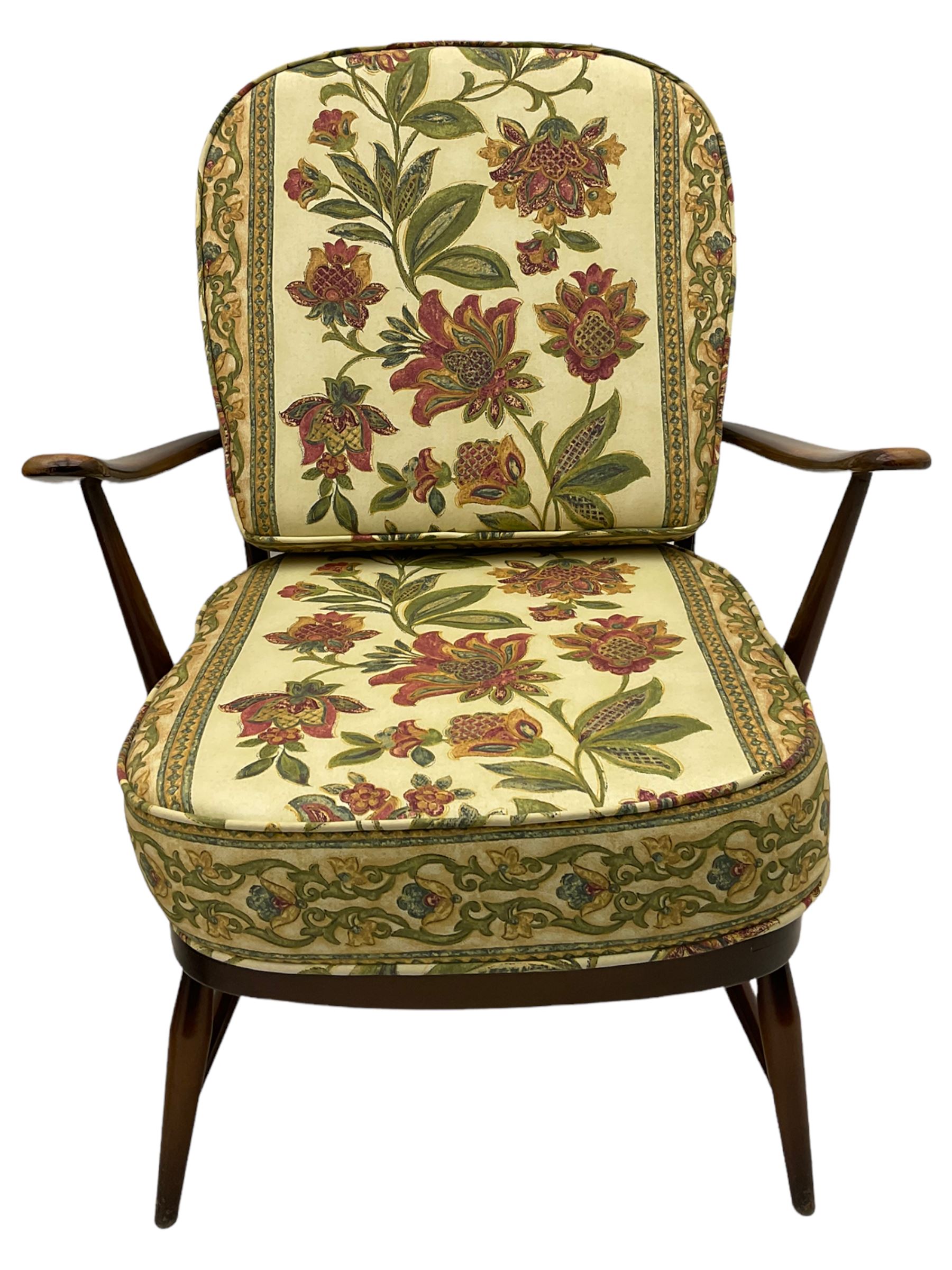 Ercol - Pair of mid-20th centur medium elm framed easy chairs, with loose patterned covers with folate design