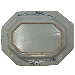 Two 18th century Chinese export octagonal platters, decorated with scenes of peonies and other flowers in a fenced garden, L50cm