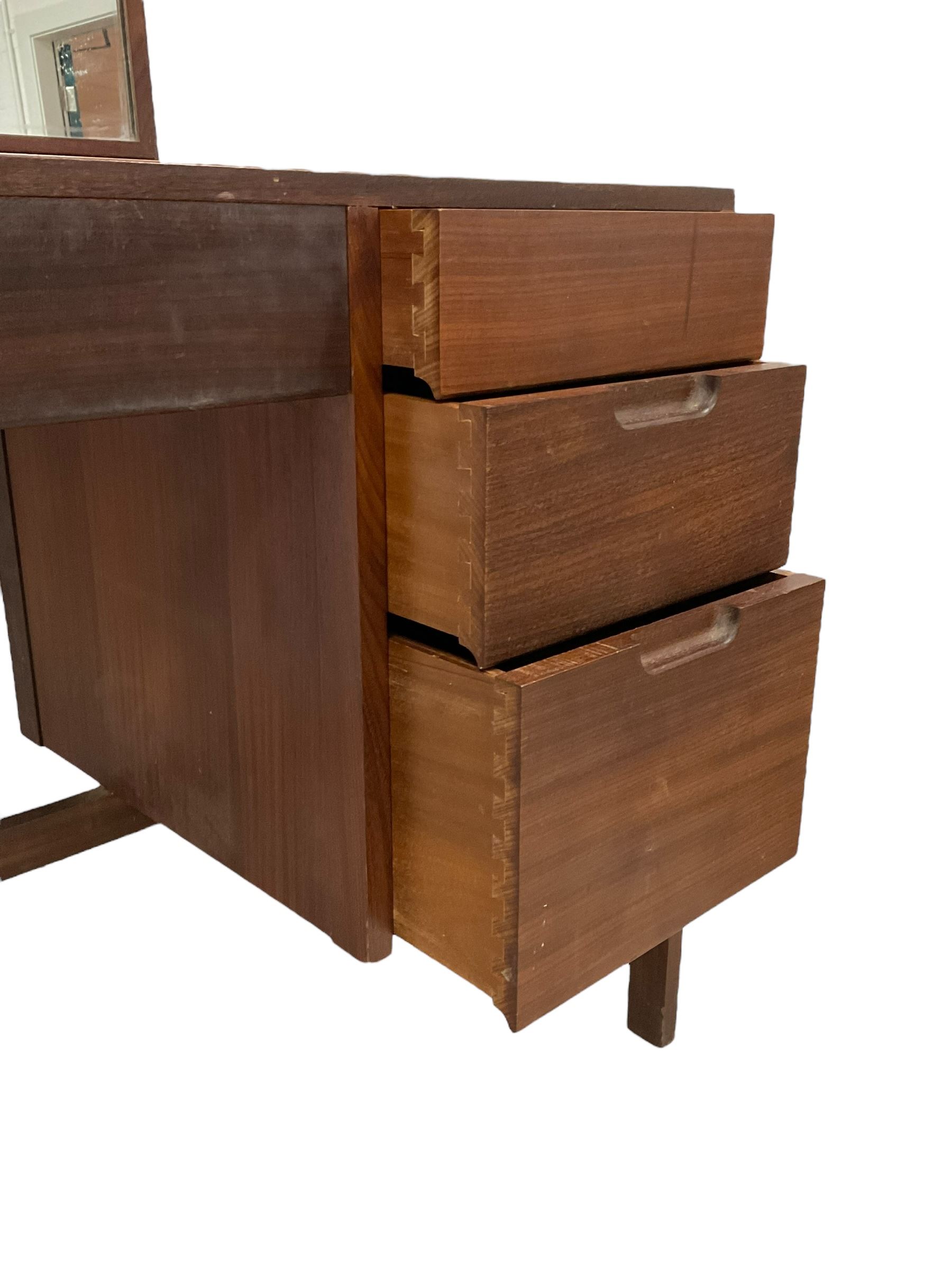 Vanson - mid-20th century teak dressing table, raised rectangular swing mirror, fitted with four drawers 