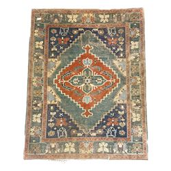 Turkish Yörük green and blue ground rug, central lozenges decorated with stylised plant motifs