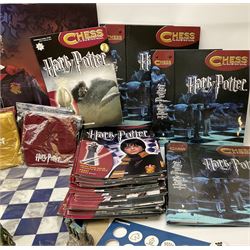 Complete DeAgostini Harry Potter chess step by step course with accessories, wand etc, including periodicals Nos. 1-82 (lacking No.68) with four binders, two chess sets with framed board, one traditional style the other fantasy, in original box.