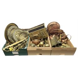 Quantity of copper pans and teapots, dish and sieve with pierced heart decoration and brass handle, together with quantity of brassware to include brass Art Nouveau crumb tray and brush, repousse chargers, fire tool accessories, decorative canon, sword and guns etc