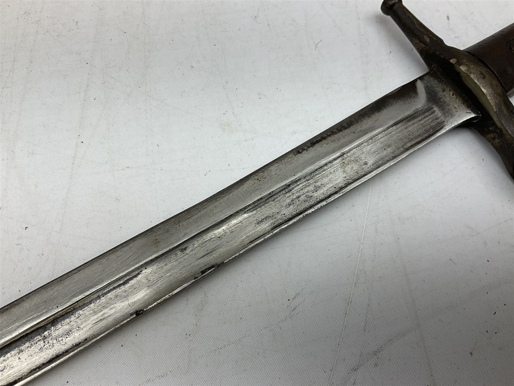 Italian Model 1891 Carcano knife bayonet with 30cm fullered steel blade, the cross-piece stamped VL1110; in steel scabbard with webbing frog L43cm overall; and another Italian fighting knife/bayonet in brass bound leather scabbard (2)