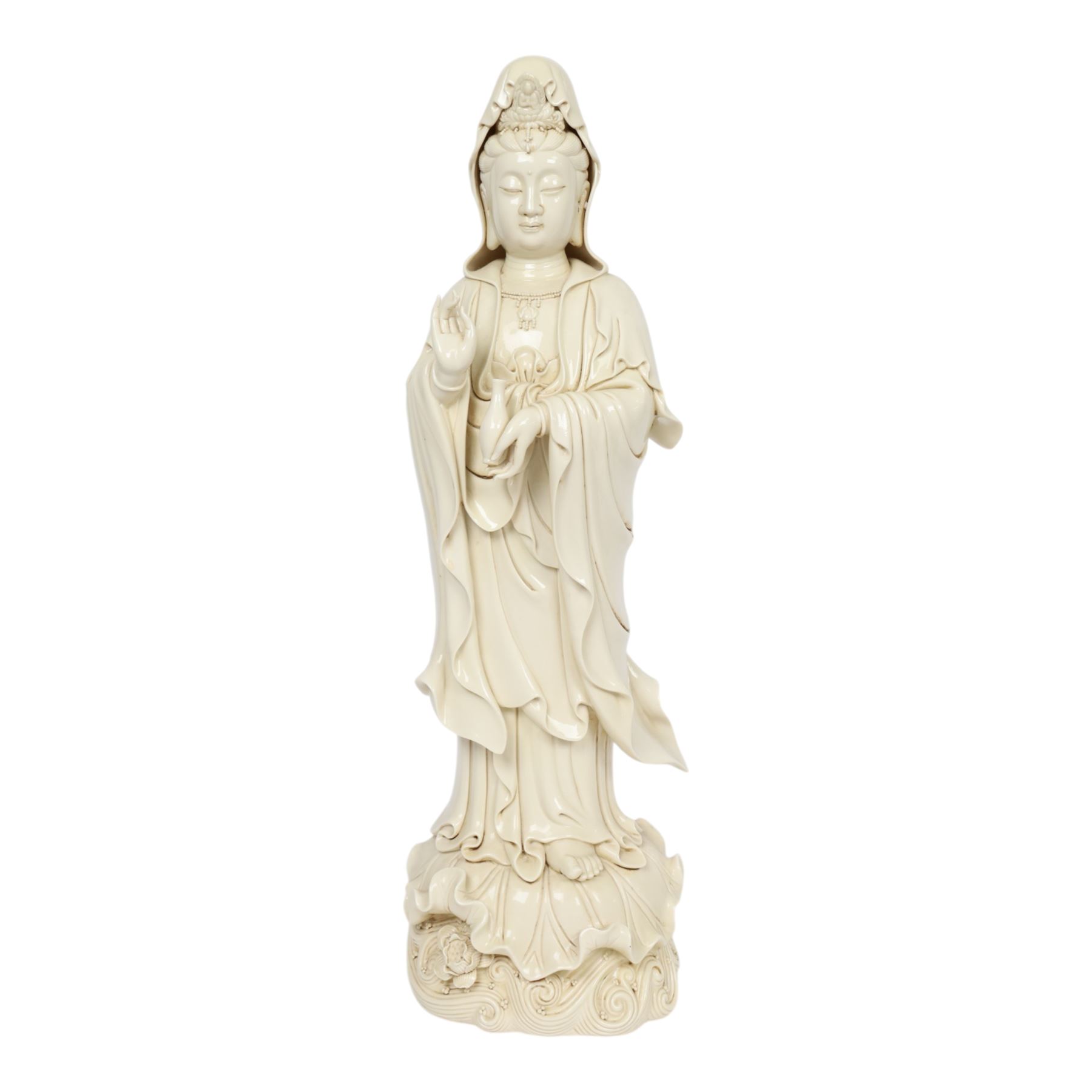 Large Chinese blanc de chine figure of Guanyin, depicting the goddess stood upon a lotus leaf with one hand raised, with potters seal mark to the reverse, H75cm