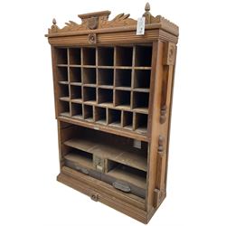 19th century stained pitch pine 'US Mail' pigeonhole unit, raised carved gallery with applied inscribed shield plaque, fitted with twenty five pigeon holes over shelves and correspondence drawers
