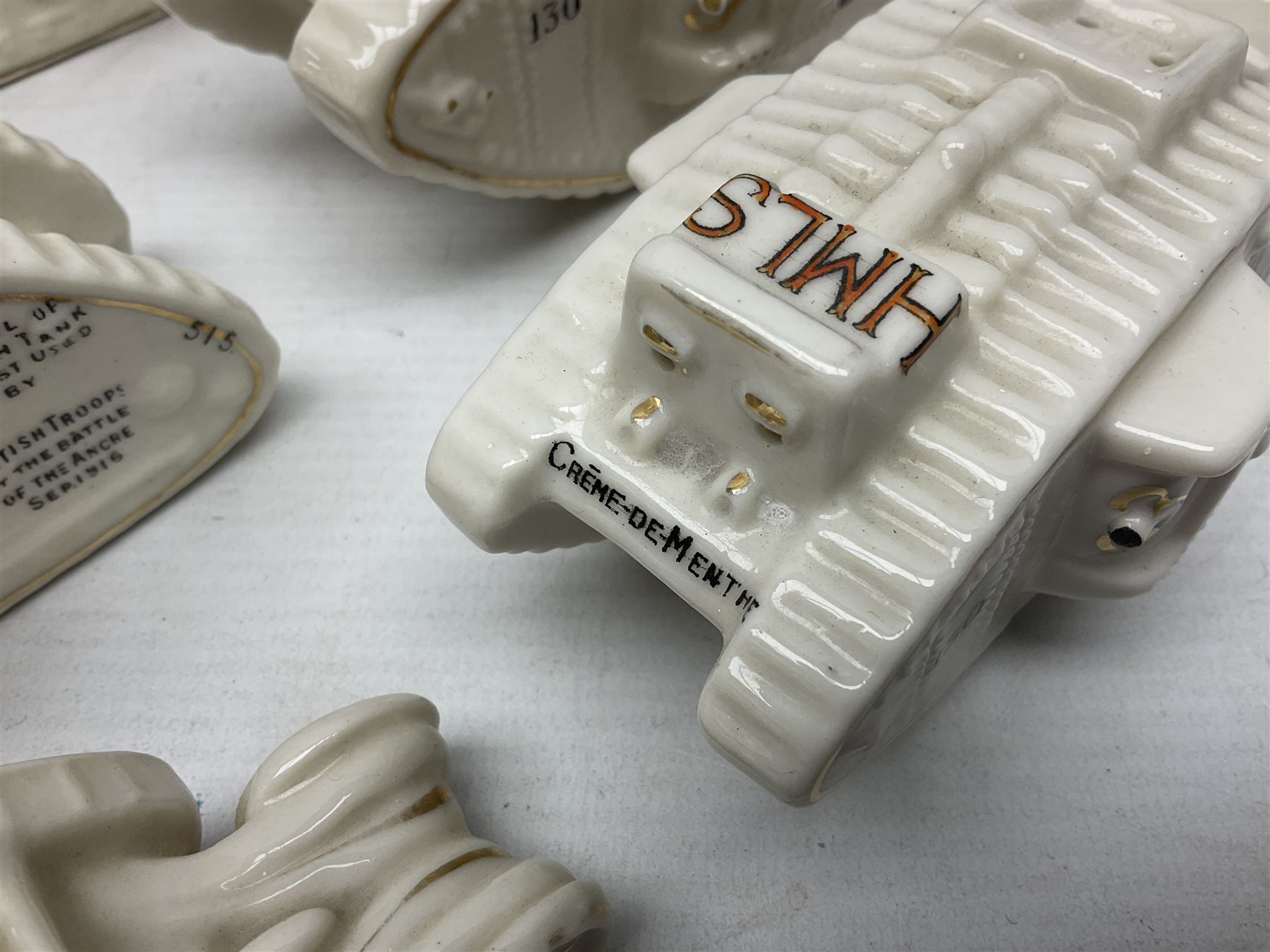 Twelve crested china models of WW1 tanks by Grafton, Arcadian and Carlton china etc with crests from Caistor Lincs, Saffron Walden, Paignton, Evesham etc  , together with a crested china model of the R.M.S Lusitania with New Brighton crest and a two-handled vase for 'The Forts Boxhill' (14)