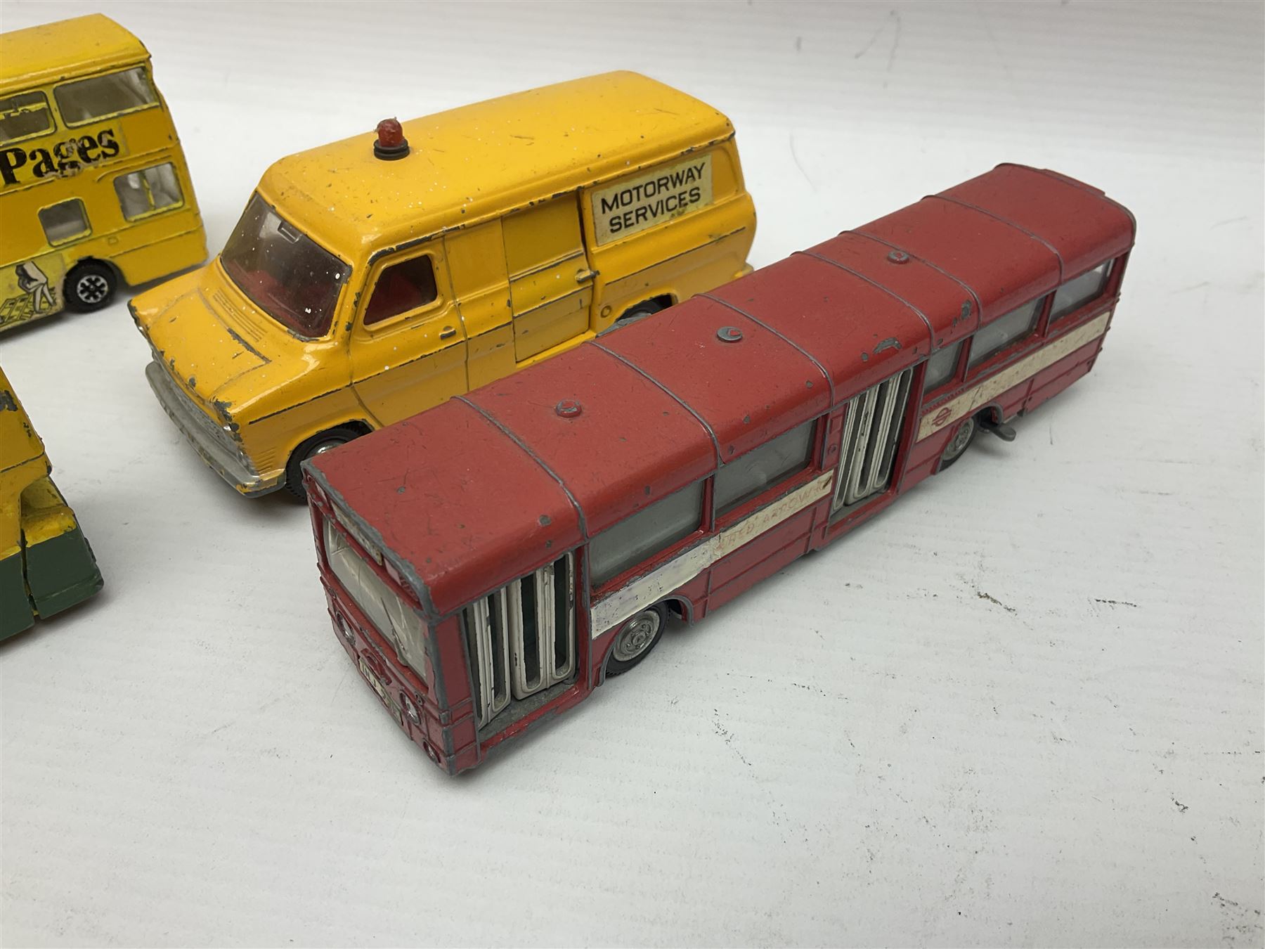 Dinky - sixteen unboxed and playworn die-cast models to include Single Deck Bus, two Atlantean Buses, Ford Transit Van, 10 Ton Army Truck, MGB Sports Car, Telephone Service Van etc 