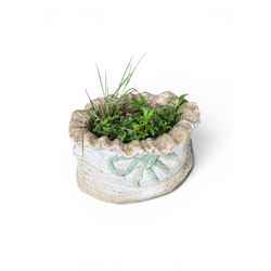 Four cast stone garden planters in the form of ribbon tied planting sacks