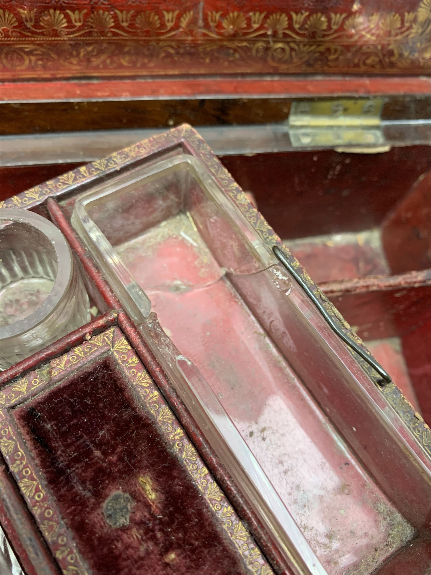 Victorian rosewood vanity box, with scrolling foliate brass inlay and twin brass inset campaign style handles, the hinged cover opening to reveal a gilt tooled interior with divisions, L33cm D22.5cm H13cm