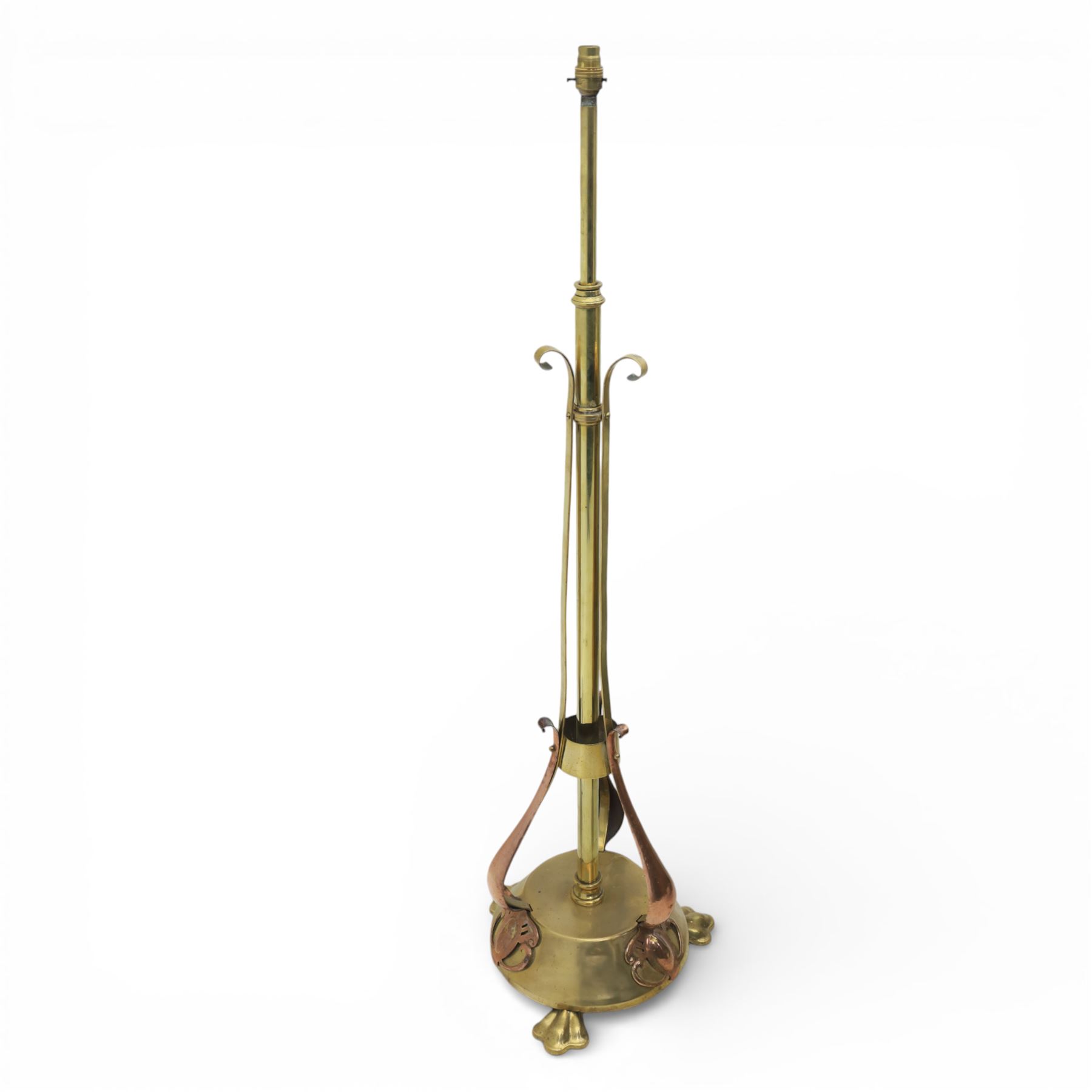 Arts and Crafts copper and brass standard lamp, in the manner of W A S Benson, slender tubular column with adjustable height mechanism, applied copper scroll brackets, circular weighted base with copper struts and stylised feet