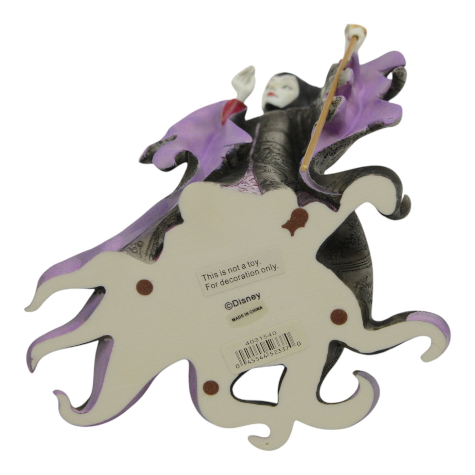 Disney Showcase Haute Couture figures, comprising Evil Queen, Cruella Devil and two Malificent, all boxed