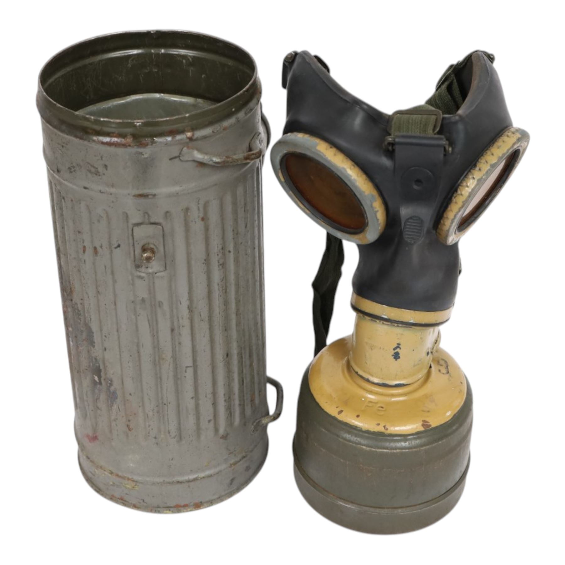 WWII German armed forces gas mask, housed in the original issue tin, tin H27cm