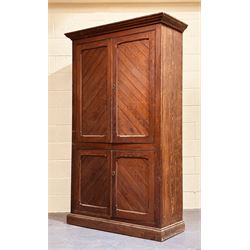 Early 20th century pitch pine school cupboard, the four panelled doors enclosing shelves, ...
