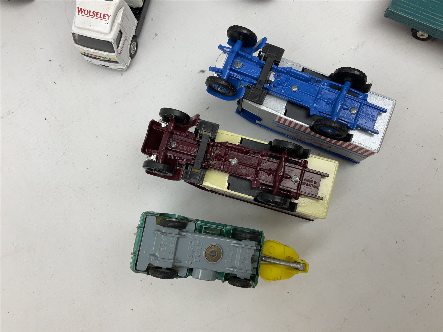 Corgi - eighteen unboxed and playworn/repainted die-cast commercial vehicles including Commer 5-Ton Wagon with drop-side trailer and two other 5-Ton wagons, Dodge Key Fargo, Jeep FC-150, two London Routemaster buses, Carrimore Trideck Transporter, two Carrimore Mark IV Transporters, Carrimore Low Loader, Ecurie Ecosse Racing Car Transporter etc (18)