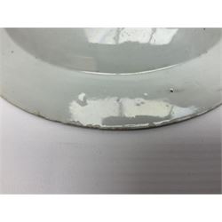 Three 18th century Chinese Famille Rose plates, the first example enamelled with blossoming peonies, rockwork and fence, the other two examples of similar design, decorated with blossoming peonies and sprigs within shaped inner borders, each approximately D23cm