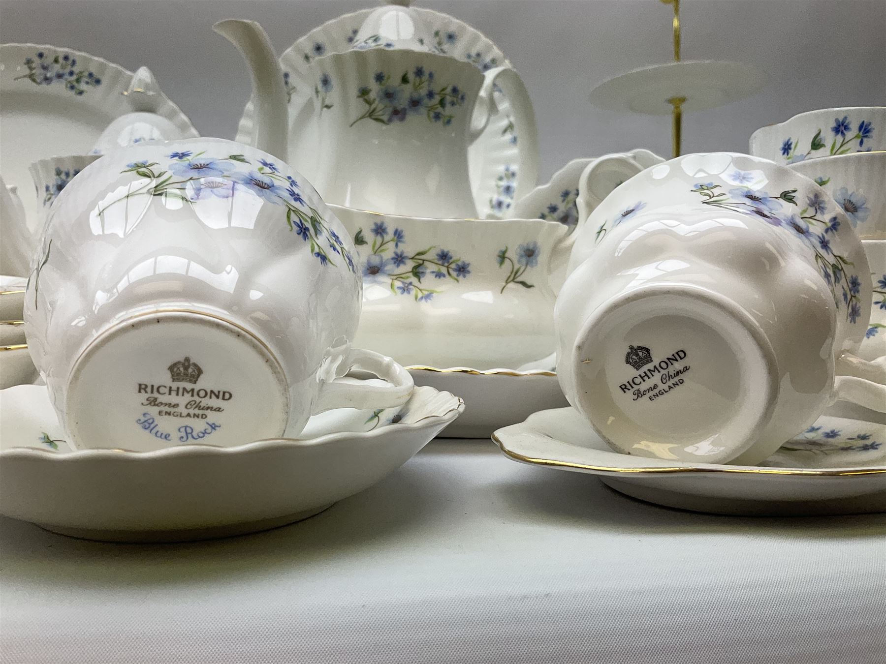 Extensive Richmond Blue Rock pattern part tea and dinner service, to include seven dinner plates, nine smaller plates, three lidded twin handled tureens, two teapots and two coffee pots, eleven bowls, cake stand, six twin handled soup bowls and saucers, six teacups, four coffee cups, milk jugs, sucrier, cake plate, salt and pepper shakers, other plates, dishes, bowls, side plates and many spares etc