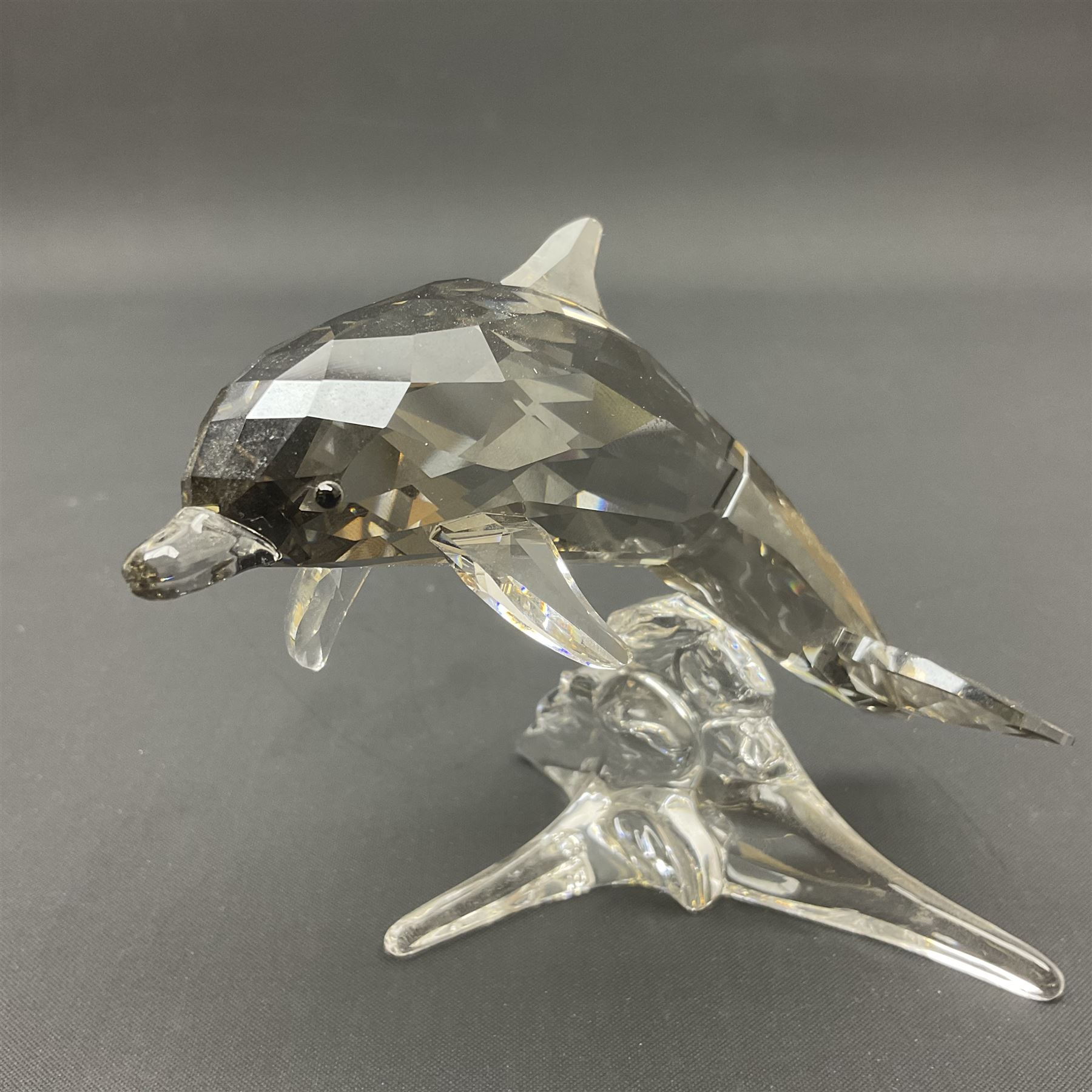 Swarovski Crystal sea creatures, comprising lion fish and dolphin, both with coloured elements, together with two seahorses, two small fish groups, butterfly fish, longnose butterfly fish and six coloured shells, tallest H8.5cm