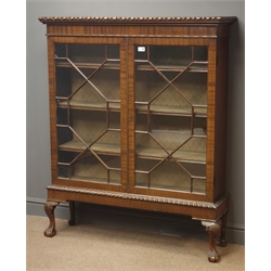  Early 20th century mahogany display cabinet, two astragal glazed doors enclosing three shelves, shell carved cabriole supports with ball and claw feet, W107cm, H130cm, D30cm  