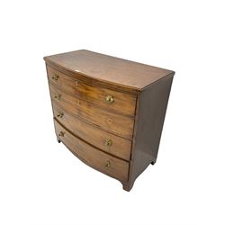 Regency mahogany bow front chest, the top with ebony and satinwood stringing, fitted with four cockbeaded drawers with brass pull handles and bone escutcheons, on bracket feet