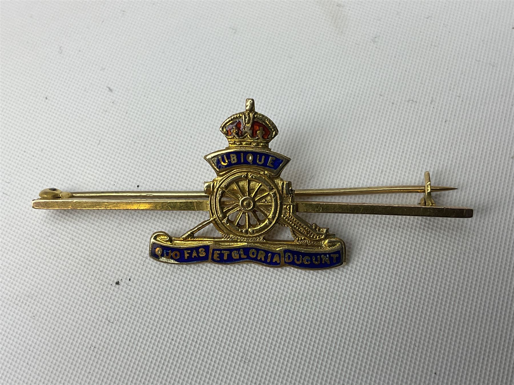 Royal Artillery 9ct gold and enamel sweetheart brooch in original box; together with Royal Artillery shoulder title, brass badges and buttons; and WW2 Defence Medal in issue box to 232775 addressed to Mrs. J.M. Morgan