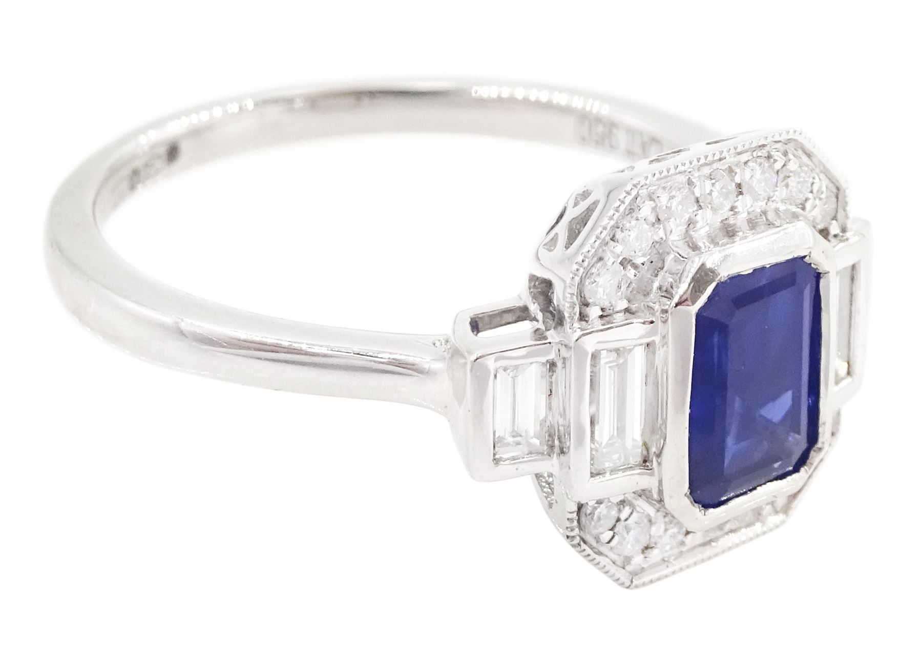 Platinum sapphire and diamond ring, single octagonal cut sapphire of approx 1.15 carat, flanked by two baguette cut diamonds and milgrain set round brilliant cut diamond surround, hallmarked, total diamond weight approx 0.35 carat