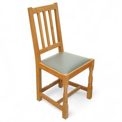 Beaverman - Six dining chairs, comprising four side chairs and two carvers, each with slatted backs, grey leather seats and square chamfered front supports, carved with signature beaver to the back stretcher, by Colin Almack of Sutton near Thirsk 