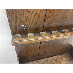 George III oak spoon rack and candle box, the rectangular backplate with shaped  pediment and two six aperture spoon racks, above a candlebox with hinged cover, with various brass spoons and a pair of brass candle snuffers, H56.5cm, W35cm, D14cm 